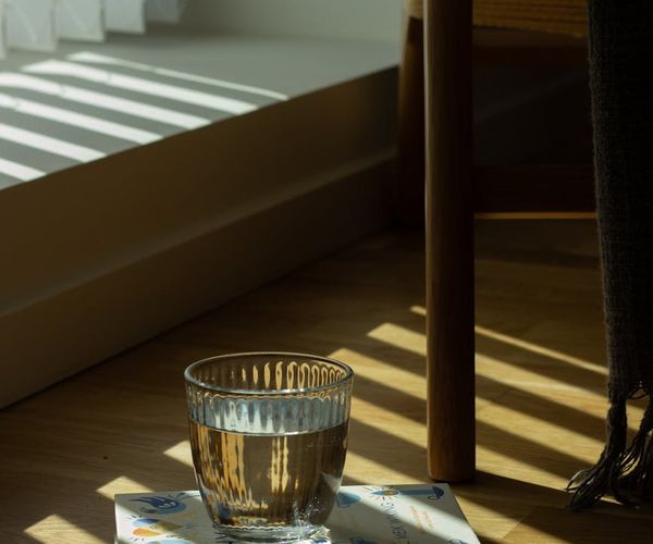 A comfortable chair in a quiet corner with soft light.